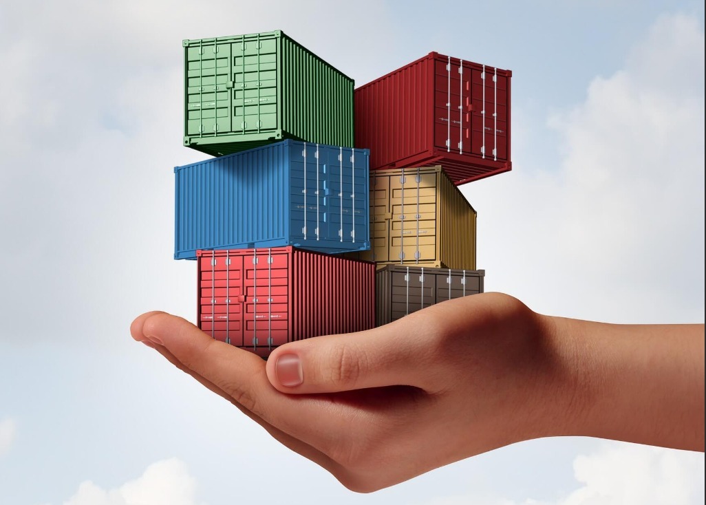 many cargo containers in a person's hand